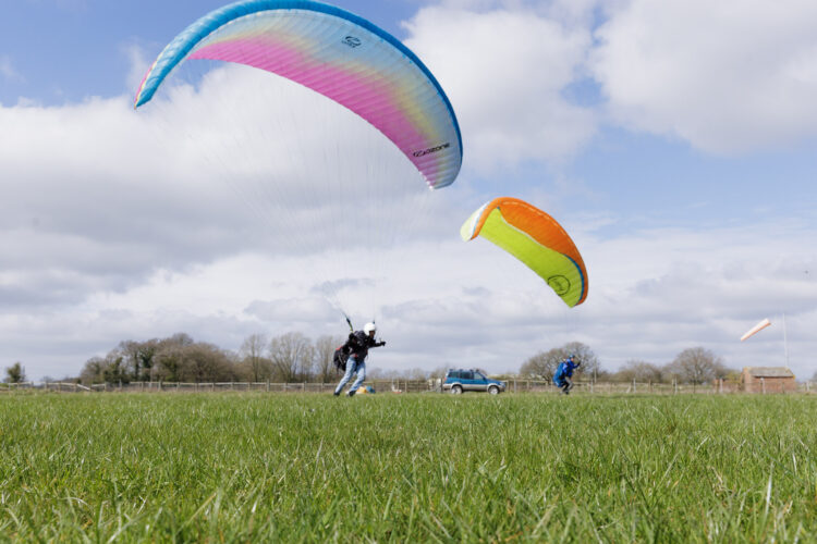 Paragliding over open fields
